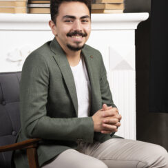 Young hadsome man crossed hand and smiling Young hadsome man crossed hand and smiling. High quality photo